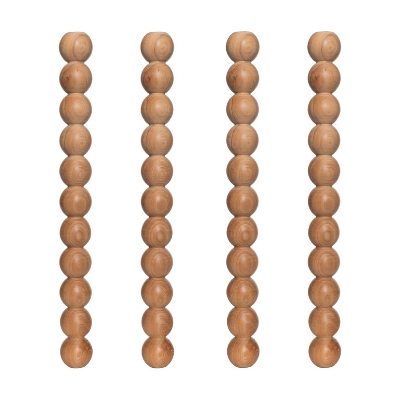 May include: Three wooden bead strands, each with 15 beads, arranged vertically in a row.