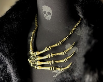 Skeleton Hand Necklace Bone Jewelry Available in 2 Colourways Gold and Silver.