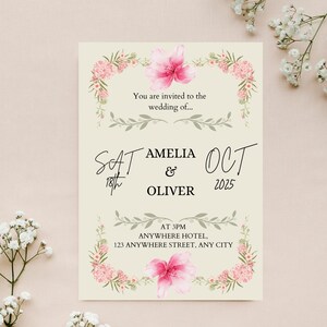 May include: A wedding invitation with a floral border and the text "You are invited to the wedding of... Amelia & Oliver, Sat 18th Oct 2025, At 3PM, Anywhere Hotel, 123 Anywhere Street, Any City."