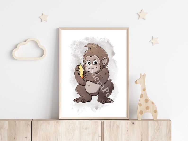 May include: A brown cartoon monkey holding a yellow banana, with a watercolor background.