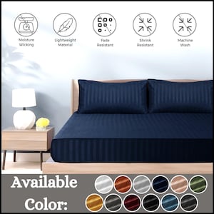 May include: Navy blue striped fitted sheet with two matching pillowcases. The sheet is made from a lightweight, moisture-wicking material that is fade and shrink resistant. It is machine washable. Available colours include white, orange, grey, black, red, teal, gold, and more.