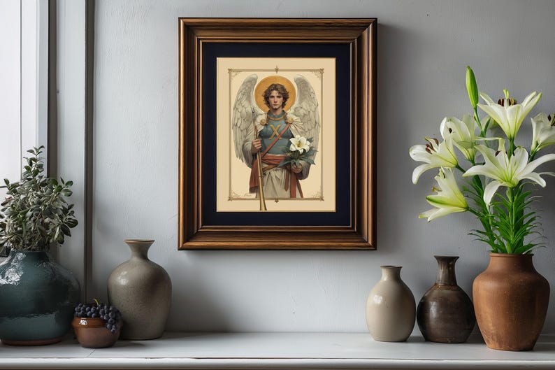 May include: A framed print of a painting depicting an angel with wings, holding a staff and a white flower. The angel is wearing a blue and white tunic and has a halo.