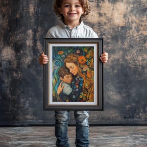 May include: A framed painting of a mother and child embracing. The mother has long, flowing hair and is wearing a blue and green dress. The child is wearing a blue shirt. The painting is surrounded by a black frame with a gold trim.