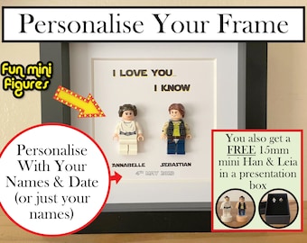 May include: A white picture frame with a black mat and a white background. The frame is personalized with two Lego minifigures, the names "Annabelle" and "Sebastian", and the date "4th May 2023". The text "I love you... I know" is printed on the background. The frame also includes a free 15mm mini Han & Leia in a presentation box.