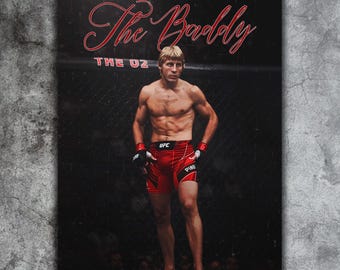 May include: A poster featuring a shirtless athlete in red shorts and black gloves, standing in a fighting ring. The text "The Baddy" is written in red script above the athlete, with "THE OZ" below.