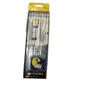 May include: A package of pencils featuring a Pac-Man design. The pencils are white with a Pac-Man graphic and text. The packaging is black with a yellow and blue Pac-Man logo and the text "CUT RATE TOYS $1.00".