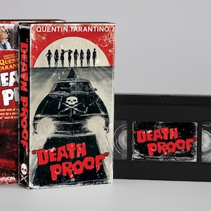 May include: A black VHS cassette tape and its cardboard slipcase featuring the movie title Death Proof in red lettering. The cover art displays a black car with a skull and crossbones hood graphic, a red circular background, and silhouettes.