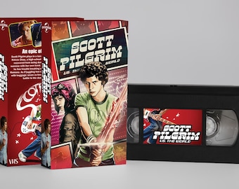 May include: A VHS tape and box set for "Scott Pilgrim vs. the World." The box set is red with character illustrations and the film's title. The VHS tape is black with a red label featuring the film's title and a guitar player.