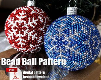 May include: Two beaded Christmas ornaments, one red with white snowflakes and one blue with silver snowflakes, in a brown box with the text "Bead Ball Pattern" and "digital pattern instant download".