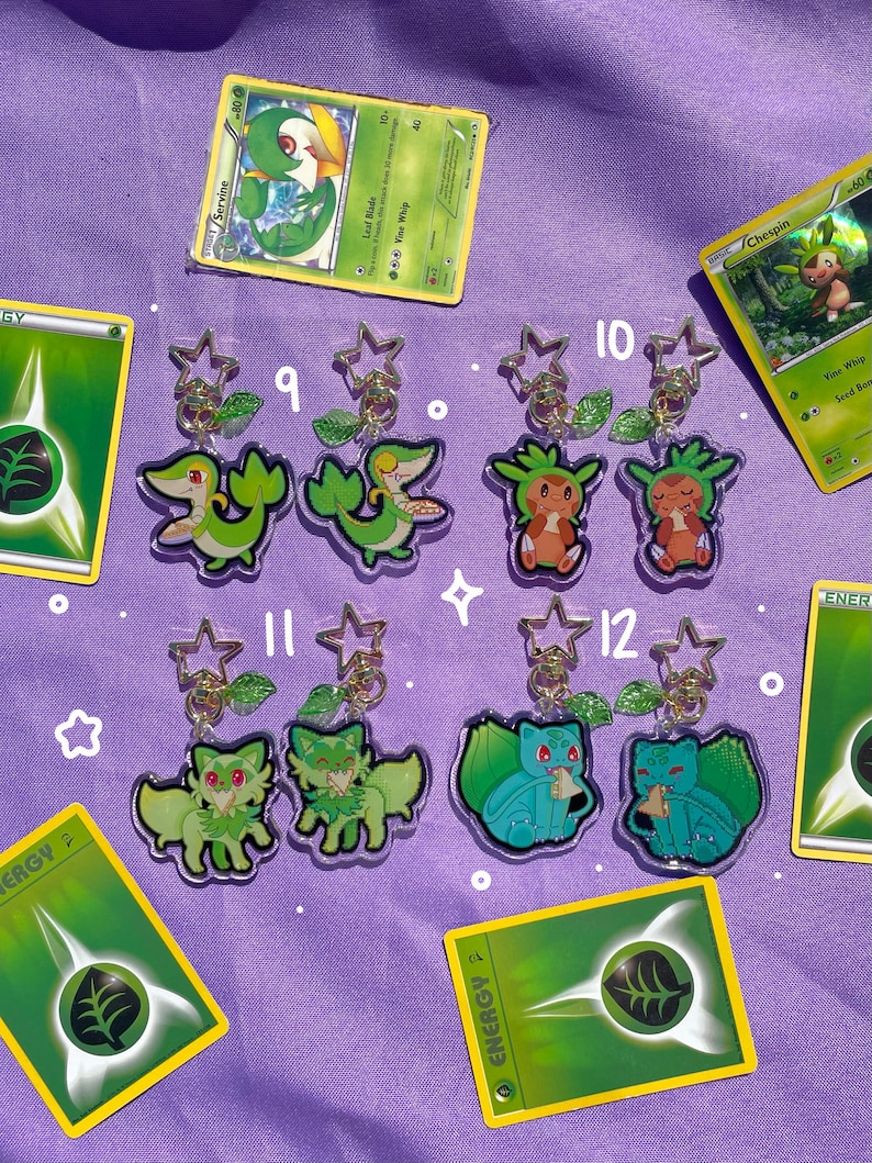 May include: A set of ten green and white Pokemon character keychains. The keychains are made of clear acrylic and feature different Pokemon characters from the Grass-type. The keychains are numbered 9 through 12.