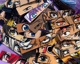 May include: A collection of colorful anime-style eye bookmarks. The bookmarks are made of clear plastic and feature different characters with large, expressive eyes. The bookmarks are perfect for adding a touch of personality to your reading experience.