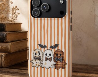 May include: A phone case featuring a vertical orange and white striped pattern. The design includes three cartoon ghosts wearing bow ties, with two small black bats positioned above them. The ghosts have distinct patterns including floral, plain white, and plaid.