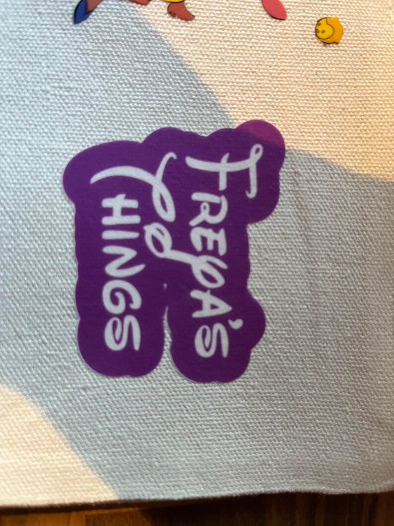May include: Purple sticker with white text that reads "Freya's Things"