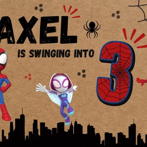 May include: A birthday-themed graphic with the name "Axel" and the phrase "is swinging into 3." Features Spider-Man, Spider-Gwen, and Miles Morales characters, along with spider web and cityscape silhouettes.