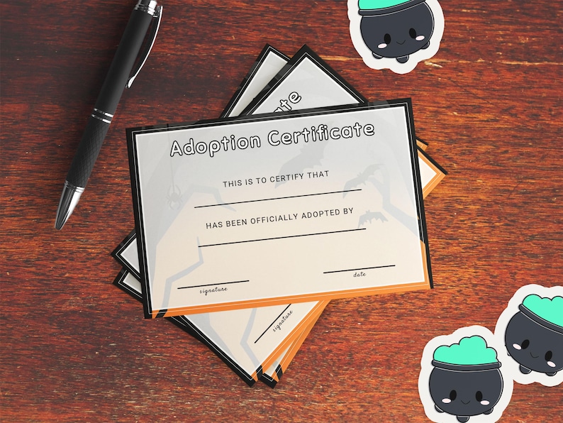 A close up photo of the printed Halloween themed adoption certificate. Bring a pen to have ready for your market clients, or mail a certificate with your purchased plushies!