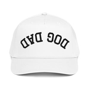 May include: White baseball cap with the text "DOG DAD" in black, arched across the front. The cap has a curved brim and a rounded crown. A casual accessory for dog lovers.