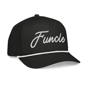 May include: Black baseball cap with the word "Funcle" embroidered in white script across the front. The cap has a white rope detail along the brim and a curved visor. The cap is a classic, casual style.