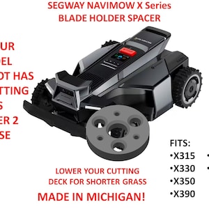 May include: A grey circular blade holder spacer for a Segway Navimow X Series robotic lawn mower. The image includes text: SEGWAY NAVIMOW X SERIES BLADE HOLDER SPACER, IF YOUR MODEL ROBOT HAS 2 CUTTING DISKS ORDER 2 PLEASE, FITS: X315, X330, X350, X390, X430, X450, LOWER YOUR CUTTING DECK FOR SHORTER GRASS, MADE IN MICHIGAN!