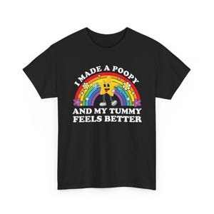 May include: Black t-shirt with a rainbow graphic and the text "I made a poopy and my tummy feels better." The graphic features a smiling star character. The rainbow has flowers on each end.