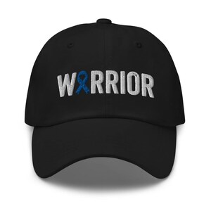 May include: Black baseball cap with a white embroidered ribbon and the word "WARRIOR" in white.