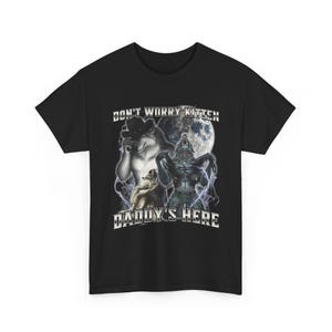 May include: Black t-shirt with a graphic featuring a werewolf, a wolf wearing a hat, and the text "DON'T WORRY KITTEN DADDY'S HERE" in white. The design includes a full moon and lightning effects.