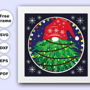 May include: A red and white gnome hat with a white snowflake pattern sits atop a green Christmas tree with white lights. The tree is surrounded by white snowflakes on a dark blue background.