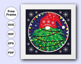 May include: A red and white gnome hat with a white snowflake pattern sits atop a green Christmas tree with white lights. The tree is surrounded by white snowflakes on a dark blue background.