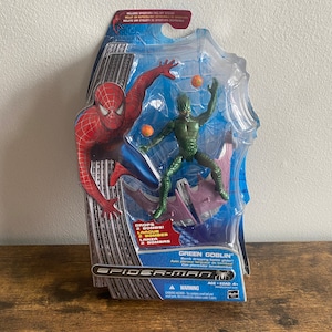 Figura de acción de Hasbro Duende Verde con planeador de batalla