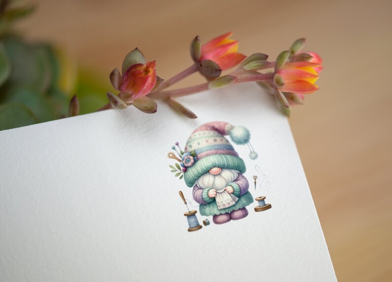 May include: A whimsical illustration of a gnome wearing a colorful knitted hat and holding a piece of fabric. The gnome is surrounded by sewing supplies, including spools of thread, needles, and scissors.