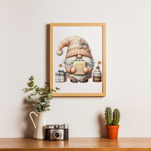 May include: A framed illustration of a gnome holding a gift box. The gnome is wearing a pink and white hat and has a white beard. The illustration is surrounded by a wooden frame.