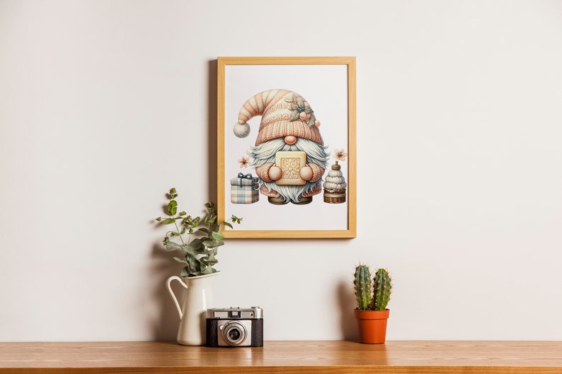 May include: A framed illustration of a gnome holding a gift box. The gnome is wearing a pink and white hat and has a white beard. The illustration is surrounded by a wooden frame.