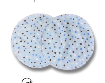May include: Two blue and white reusable nursing pads with brown polka dots. The pads have a white border with a blue trim. The text "Leakproofmama" is printed below the pads.