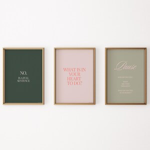 May include: Three framed prints with motivational quotes. The first print has a dark green background with the text "NO. is a full sentence." in white. The second print has a light pink background with the text "WHAT IS IN YOUR HEART TO DO?" in pink. The third print has a light green background with the text "Pause" in white and a poem about pausing in white.