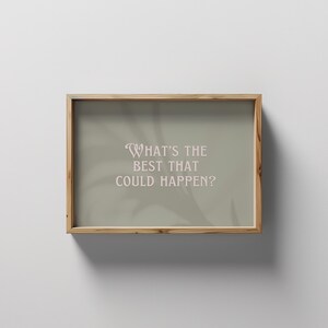 May include: A framed print with a light green background and a white shadow of a plant. The text "WHAT'S THE BEST THAT COULD HAPPEN?" is printed in pink.