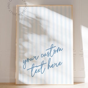 May include: A framed print with a blue and white striped background. The text "your custom text here" is written in blue cursive script.
