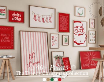 May include: A collection of framed Christmas prints in various sizes and designs. The prints feature festive text like "Merry and Bright" and "Holly Jolly", along with images of Santa Claus, stockings, and a Christmas tree. The color scheme is primarily red and white.