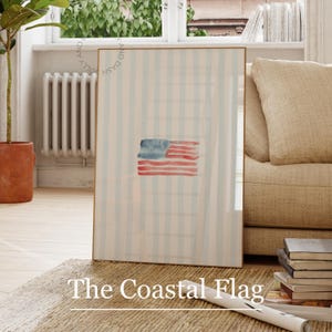 Pode incluir: Uma impressão emoldurada com uma representação em aquarela da bandeira americana. A bandeira é pintada em tons de vermelho e azul, contra um fundo de listras verticais azul claro. O texto "The Coastal Flag" é exibido na parte inferior.