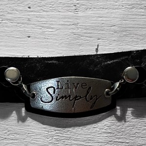 Bracelet with leather wrap and silver charm