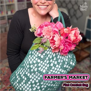 May include: A green filet crochet bag filled with pink and peach flowers. The bag has a diamond pattern and a green handle. Text on the bag reads "FARMER'S MARKET" and "Filet Crochet Bag".