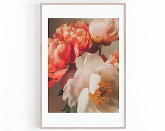 May include: A close-up of a bouquet of pink and white peonies. The flowers are in full bloom and have a soft, delicate appearance.