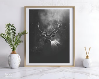 May include: A black and white photograph of a deer with large antlers standing in a forest. The deer is looking directly at the camera. The background is blurred and has a misty effect.