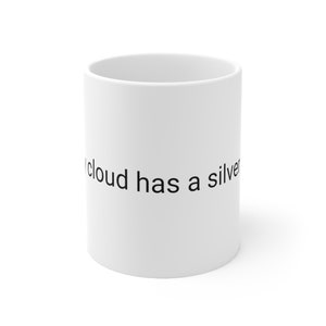 May include: White ceramic mug with black text that reads "Every cloud has a silver lining".