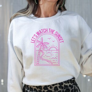 Let&#39;s Watch the Sunset: Cute White Crew Neck Sweatshirt with Pink Beach Sunset, trendy sweatshirt, beach lover, sunset, beach sweatshirt