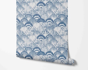 May include: Blue and white wallpaper with a repeating pattern of seashells. The seashells are arranged in a wave-like pattern.