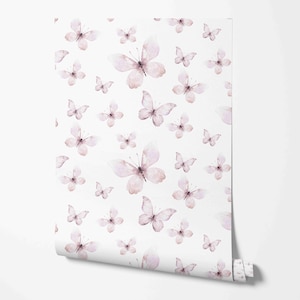 May include: White wallpaper roll featuring a repeating pattern of watercolor butterflies in shades of pink and purple. The butterflies vary in size and are scattered across the surface, creating a delicate and airy design.