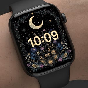May include: A black smartwatch showing the time 10:09. The watch face has a floral design with a crescent moon and stars. The watch has a black strap and a rectangular screen.