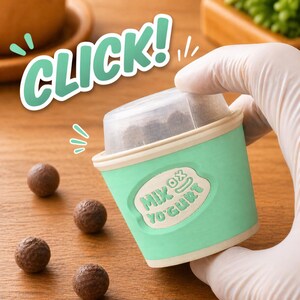 May include: A mint green yogurt container with the text "MIX OX YOGURT" and a clear lid. The word "CLICK!" is written in a bubble font above the container. Several small, round, brown treats are scattered around the container.