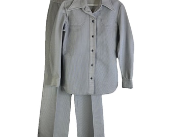 May include: A grey and white striped pantsuit with a collared button-up shirt and long trousers.