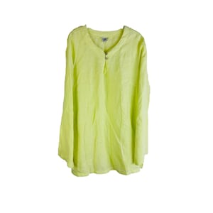 May include: A bright yellow long-sleeved shirt with a button-up neckline.