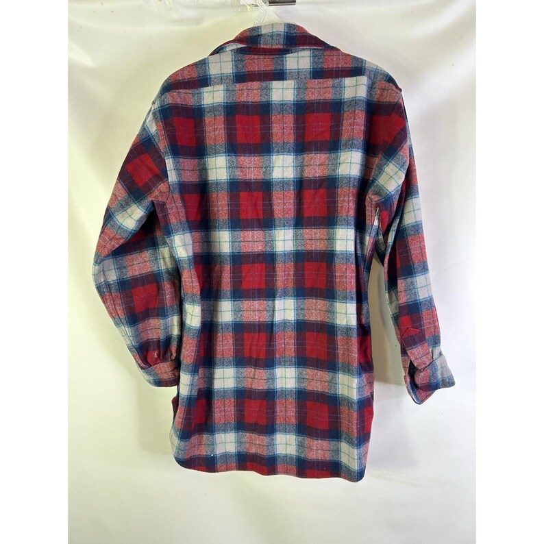 May include: A long-sleeved plaid shirt in red, blue, and white. The shirt has a button-down front and a collared neckline. The plaid pattern is a classic design, suitable for casual wear.